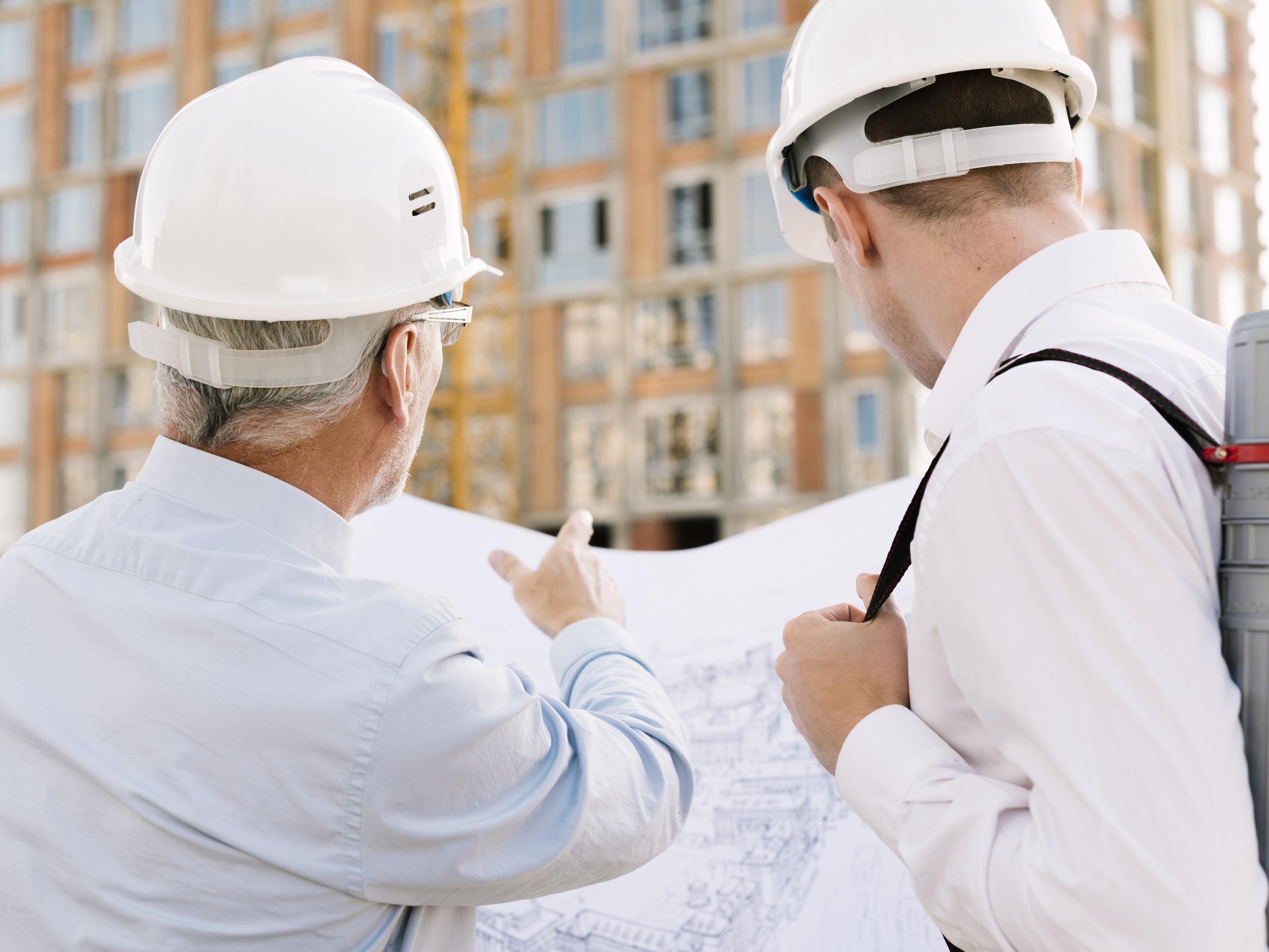 back-view-men-looking-building-design-2560×1920